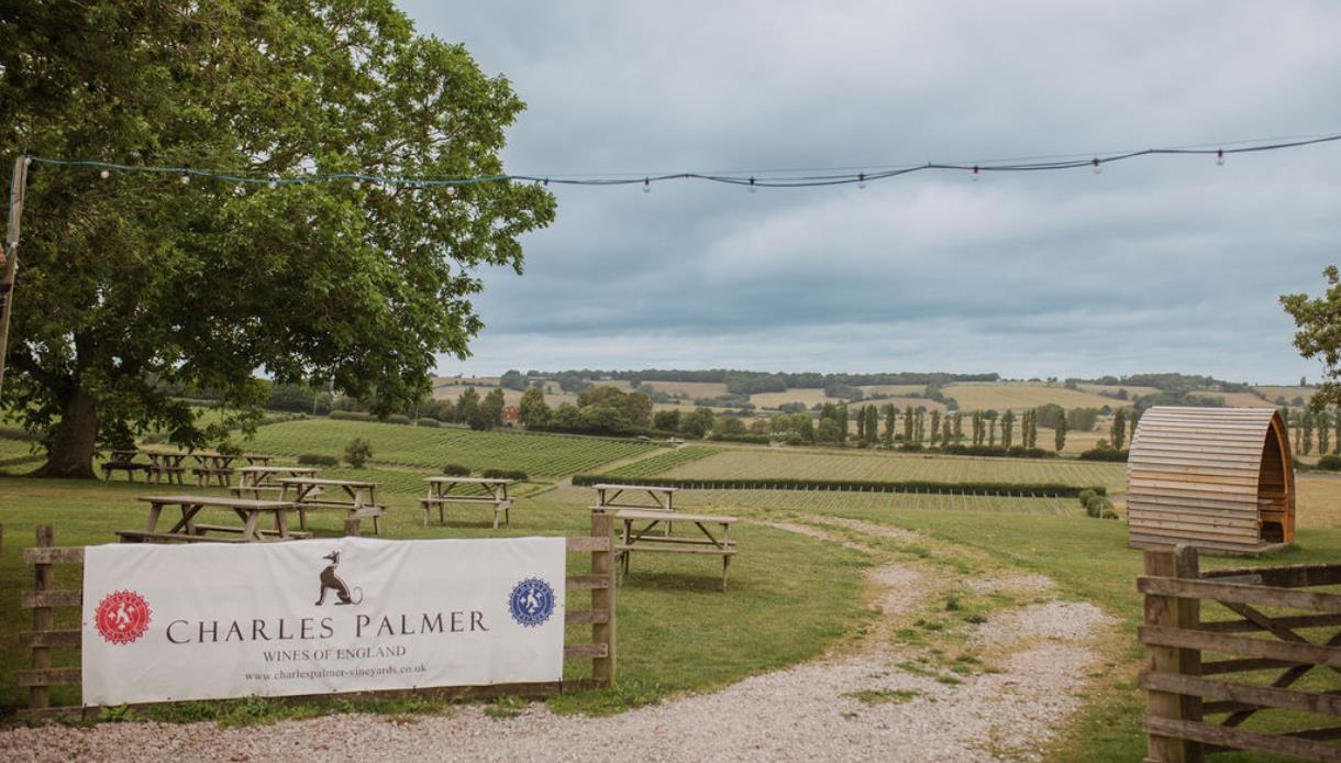 Entrance to Charles Palmer Vineyards overlooking rolling Sussex vineyards, picnic tables and countryside views.