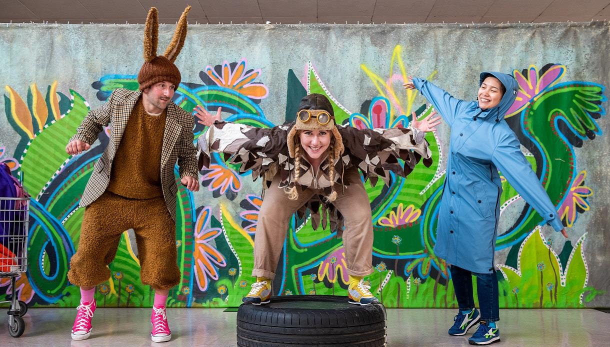 Promotional image for “Animals!” featuring performers in animal costumes against a colourful woodland backdrop.