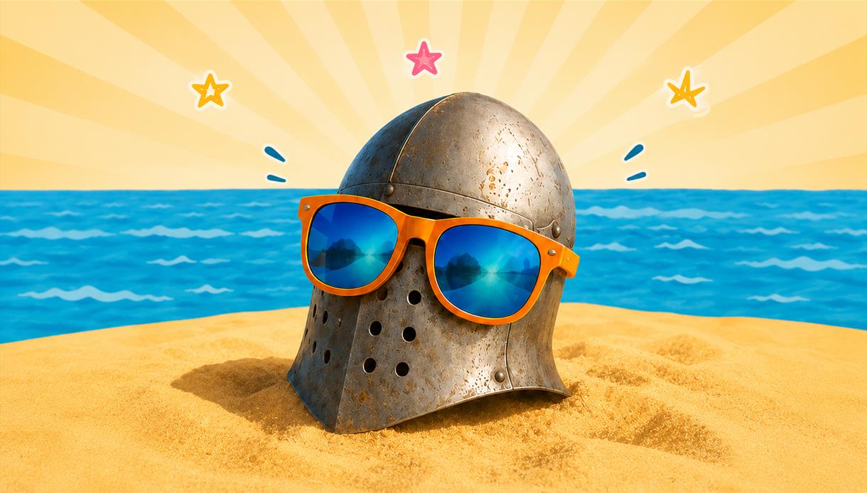 Medieval helmet wearing sunglasses on a sandy beach by the sea, promoting the “1066: Swords & Sandcastles” pop‑up event.