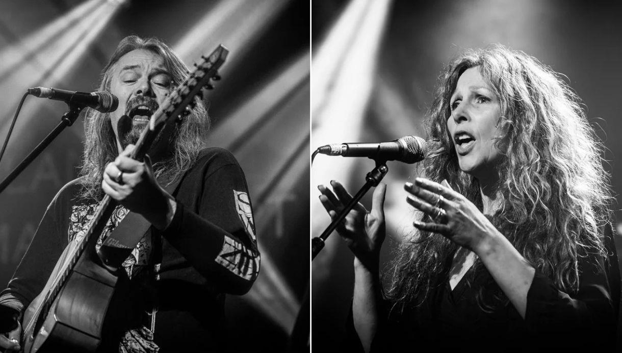 Black-and-white promotional image of acoustic duo Dandelion Charm performing live at Rye Harbour Discovery Centre.