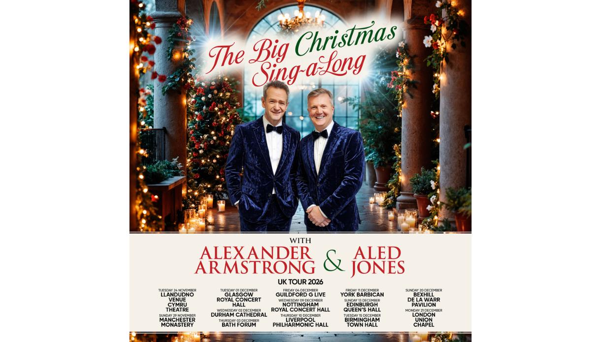 Festive Christmas concert poster with performers on stage, trees, candles, and “The Big Christmas Sing-a-Long” title.