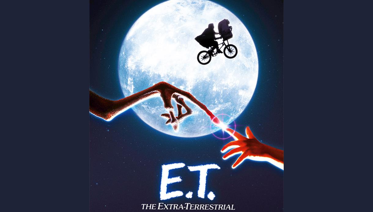 Promotional image for E.T. The Extra-Terrestrial showing a bicycle flying across the moon and touching fingertips.