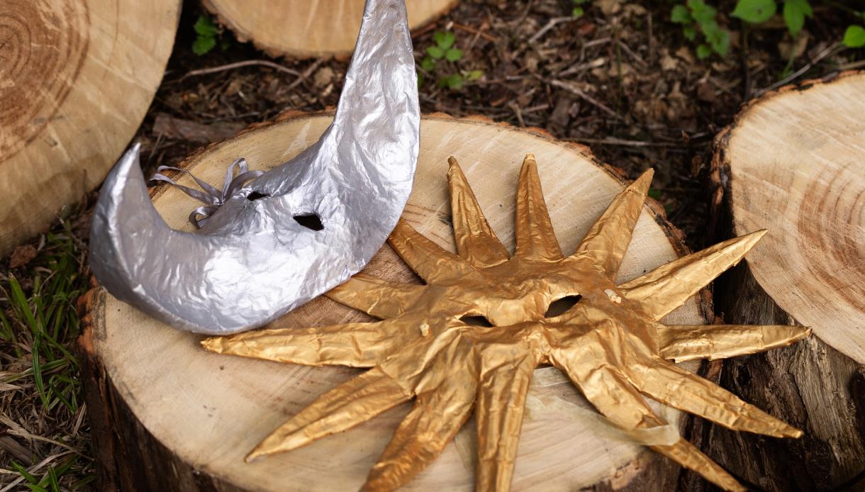 Gold sun and silver moon masks created during a family mask-making workshop at Crafted at Powdermills