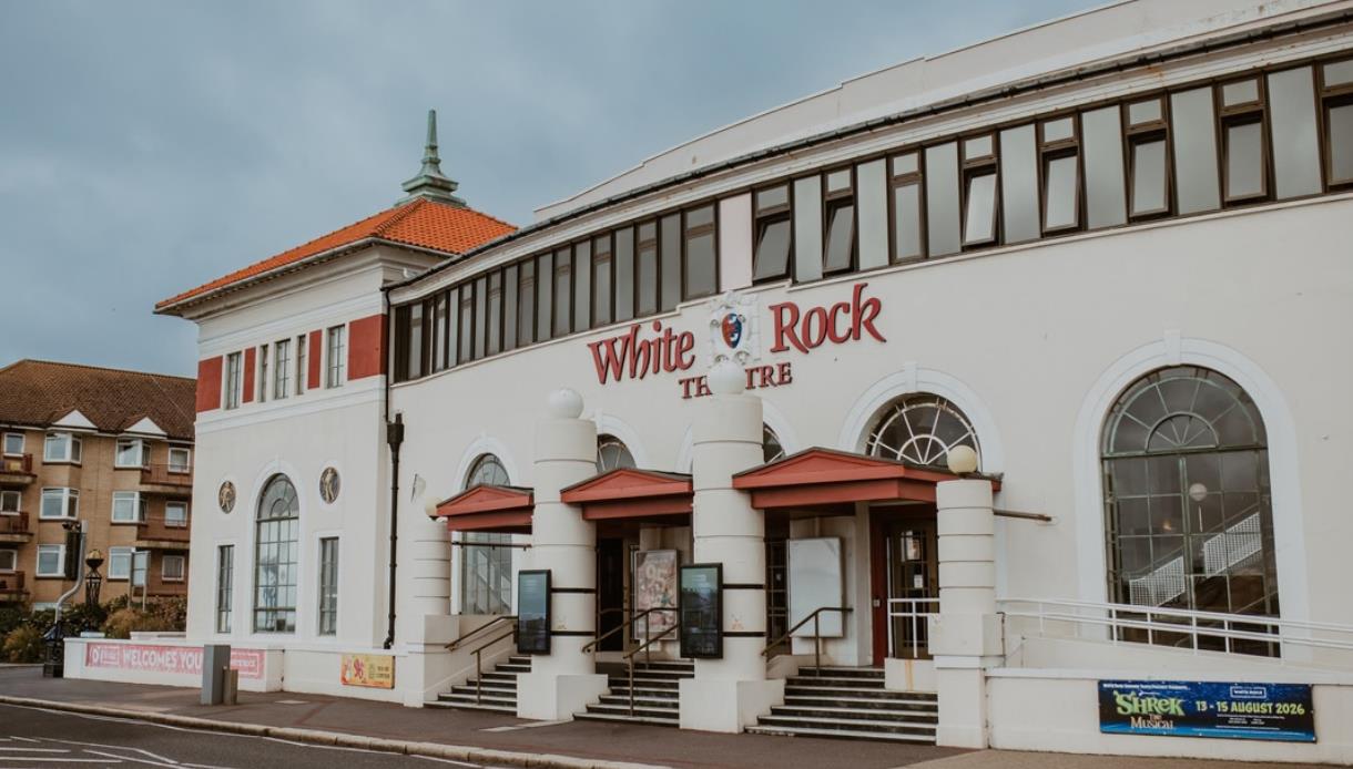 White Rock Theatre entrance on Hastings seafront with distinctive white façade and theatre signage