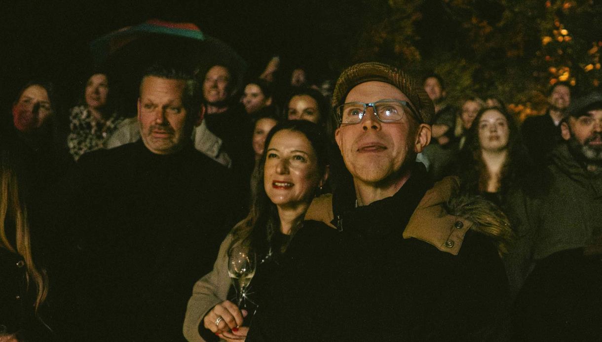 Guests gathered outdoors at night for Bonfire Night celebrations at Crafted at Powdermills.