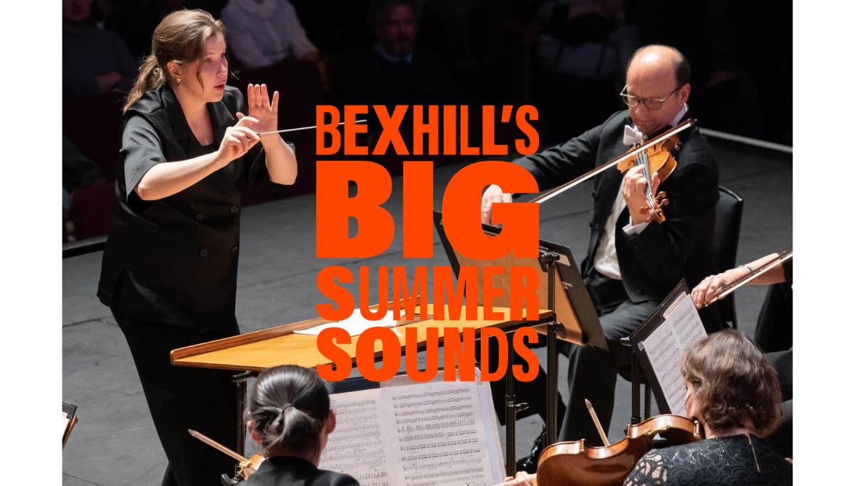 Promotional image for Bexhill’s Big Summer Sounds showing an orchestra performing, with a conductor and string players on stage.