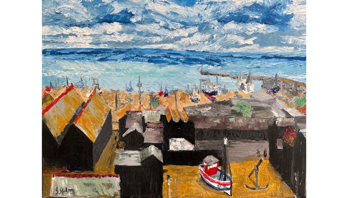 Impressionistic seaside image of Hastings, painted with thick brushstrokes. In the foreground, dark wooden sheds with slanted roofs sit on golden-brow