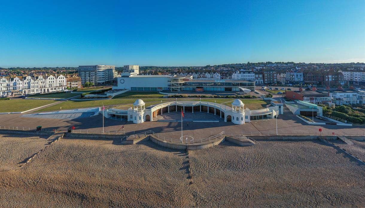 aerial view of De La Warr Pavilion, lawns and shingle beach.