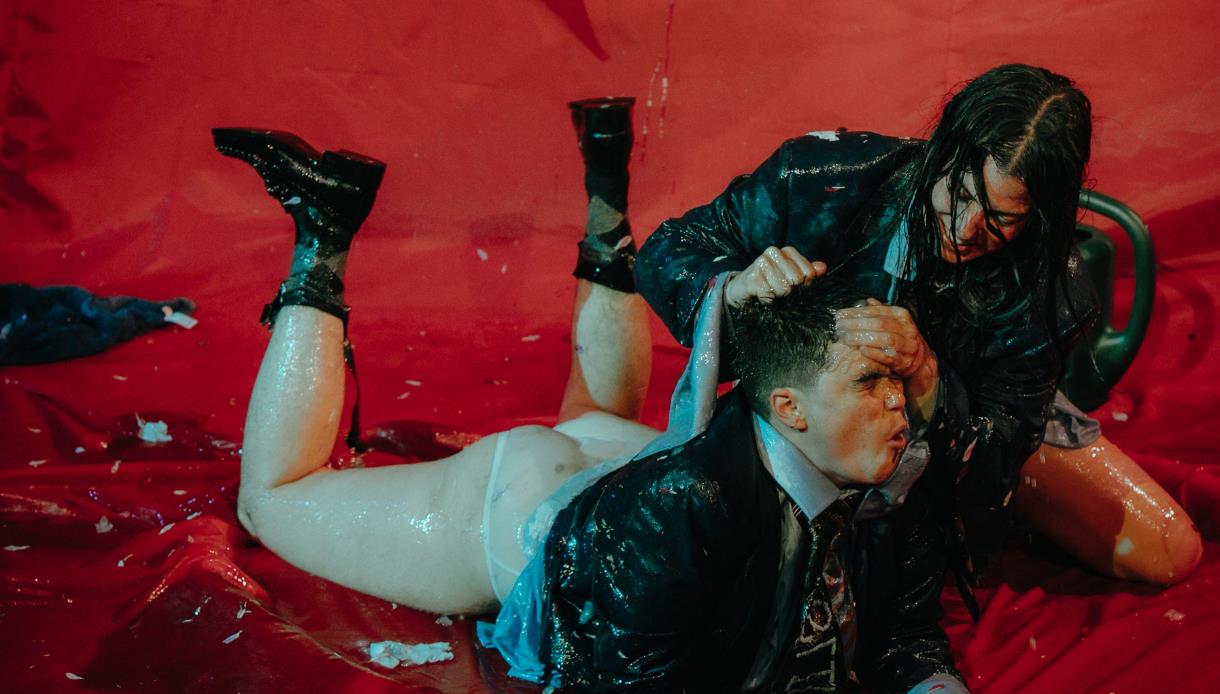 Promotional image for 50 Ways to Kill a Slug at The Stables, featuring performers in a chaotic, splash-filled scene.
