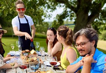 Vine + Country Wine Tours, guest seated around long al fresco table