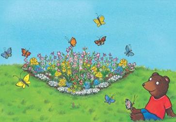 Ben plants a butterfly garden trail