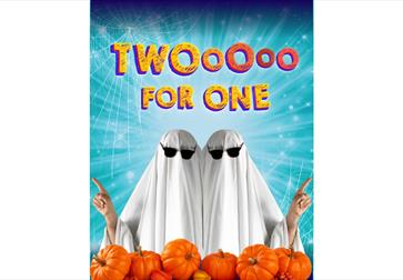 Image shows two people with white sheets over them dressed like ghosts with sunglasses on. The bottom of the image has pumpkins scattered across. Text