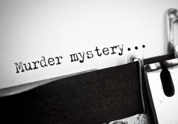 typewriter with text saying 'murder mystery'..