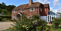 Traditional countryside holiday cottage with landscaped gardens at Rye & Beyond Holiday Cottages.