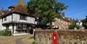 Historic timber-framed buildings and cobbled street scene in the heart of Rye, East Sussex.