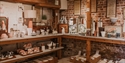 Interior display of handcrafted ceramics and pottery inside Rye Pottery shop in Rye.