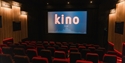 Interior of Kino Rye cinema with plush seating and large screen in a modern auditorium.