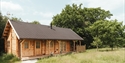 Luxury woodland lodge at Downash Wood set within a peaceful meadow and forest surroundings.