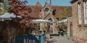Kino Rye cinema courtyard with outdoor seating set around a historic building.