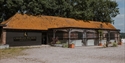 Charles Palmer Vineyards tasting room and visitor area with outdoor seating and rustic vineyard buildings.