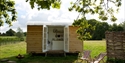 Shepherd's Hut accommodation at Oxney Organic Vineyard in Beckley, near Rye, East Sussex.