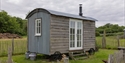 Shepherd’s hut accommodation at Oxney Organic Estate set within peaceful countryside surroundings.