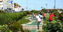 Playing on the Adventure Golf Course in Hastings East Sussex