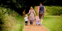 Family walking the grounds of Battle Abbey and Battlefield