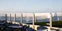 Exterior view of The Relais Cooden Beach. Shows terrace seating area with views towards the sea.