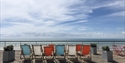 Deckchairs on the roof of the De La Warr Pavilion looking out to the sea in Bexhill East Sussex