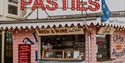 Albion Pasties takeaway stall exterior in Hastings, with signage for pasties, beer, wine and coffee.