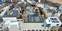 Aerial view of Hastings town centre rooftops with Bunka Rooftop terrace overlooking the seafront.