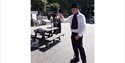 Performer in period costume speaks to crowd in Pevensey during outdoor Talking History event.