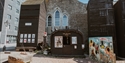 Exterior of Hastings Fishermen’s Museum with historic net huts and exhibits beside the Old Town seafront.