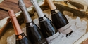 Bottles of Gusbourne sparkling wine chilling in an ice-filled bucket at the estate.