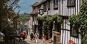 The Mermaid Inn on historic Mermaid Street in Rye, a timber-framed Tudor building draped with climbing greenery.