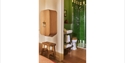 Image shows the inside of one of the bedrooms at Crafted at Powdermills, it shows the end of the bedroom looking into the adjoining bathroom. The tile