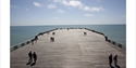 People walking on the pier head at Hastings Pier © Georgie Scott