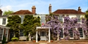 Exterior of the main building of PowderMills Hotel