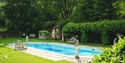 Swimming pool in the grounds of PowderMills Hotel