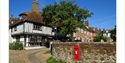 Timber framed house and postbox