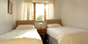 Interior view shows two single beds