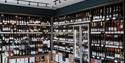 interior of wine show with shelves full of bottles
