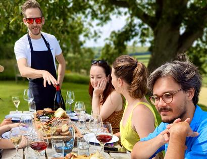 Vine + Country Wine Tours, guest seated around long al fresco table