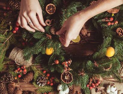 birds eye view of Christmas wreath-making workbench