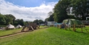 Play area and tents at Bluebell Coppice Park