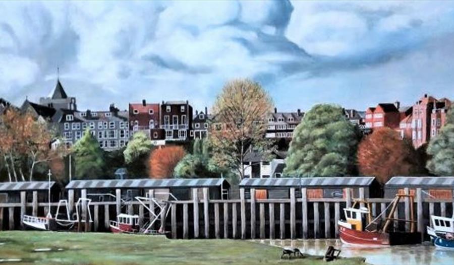 Painting of Rye Harbour. Shows small fishing boats moored with town and castle in the background.