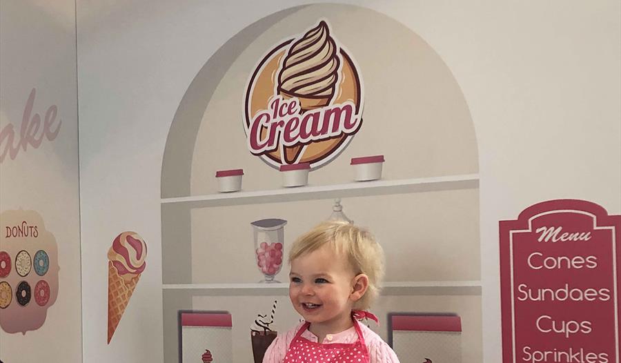 Child in a play ice cream parlour