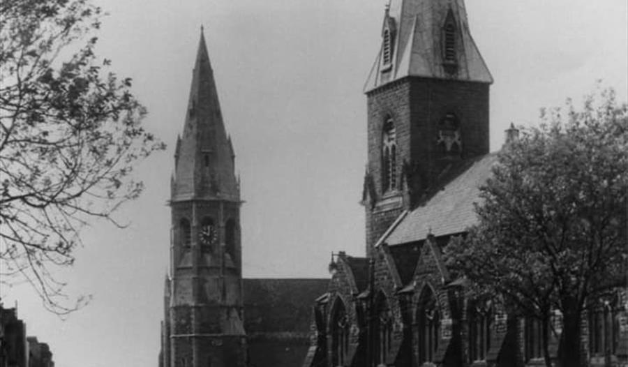 black and white photograph of two churches with spires