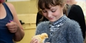 A young girl holding a chick at the Rare Breeds Centre